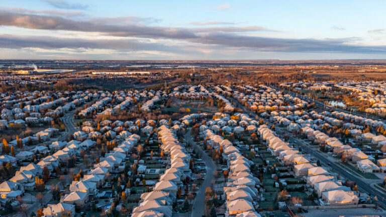 An aerial view of an Ontario subdivision of detached homes covered in snow